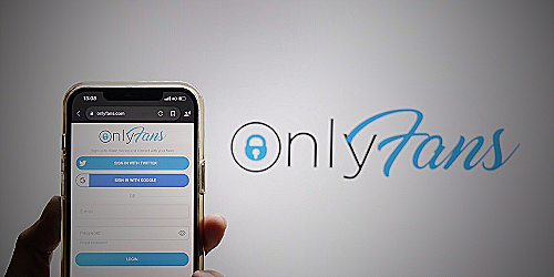 A person on their phone following OnlyFans accounts - how to start an onlyfans without followers